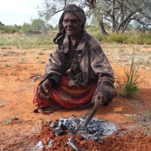 Polly Ngale cooking kangaroo tail.